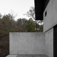 Concrete wall and black roof overhang