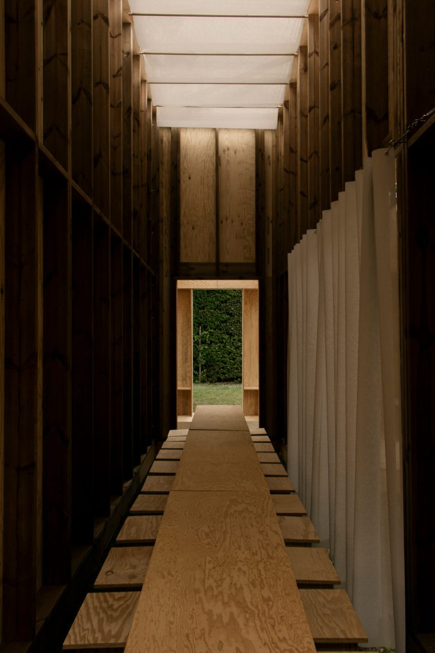 Table in a plywood pavilion by Pratique and Fanum