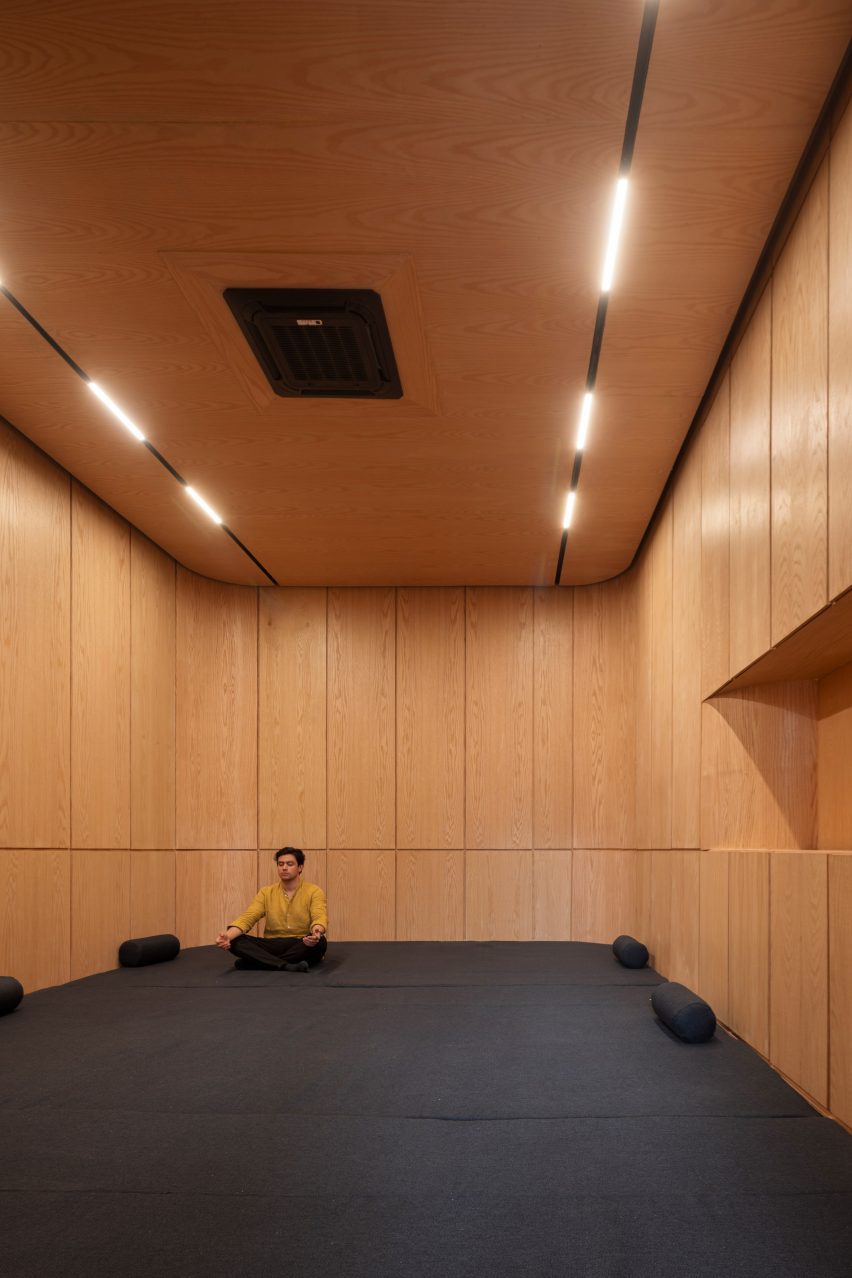 Meditation room lined with white oak panels