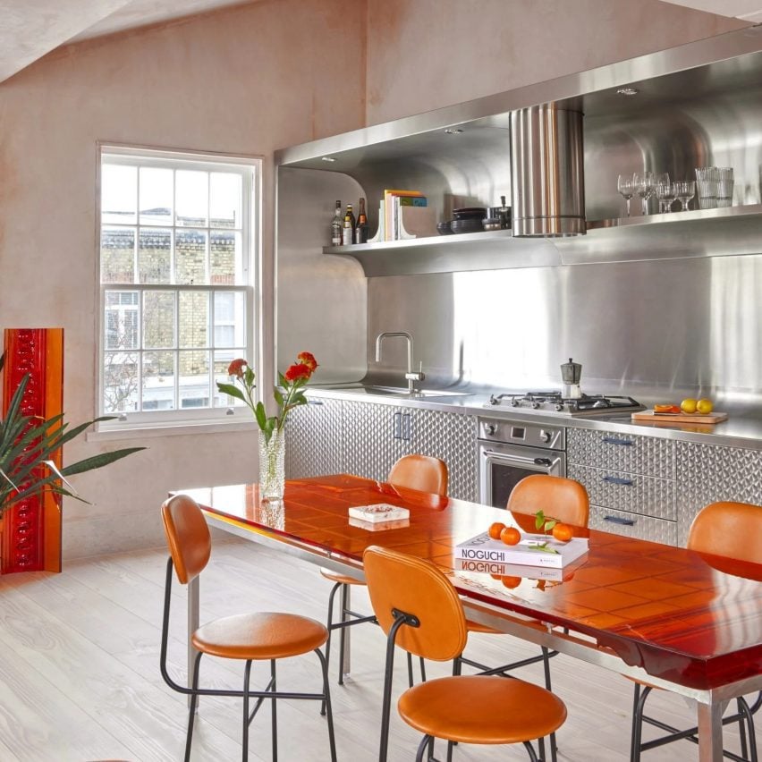 Stainless steel kitchen with orange chairs Holloway Li