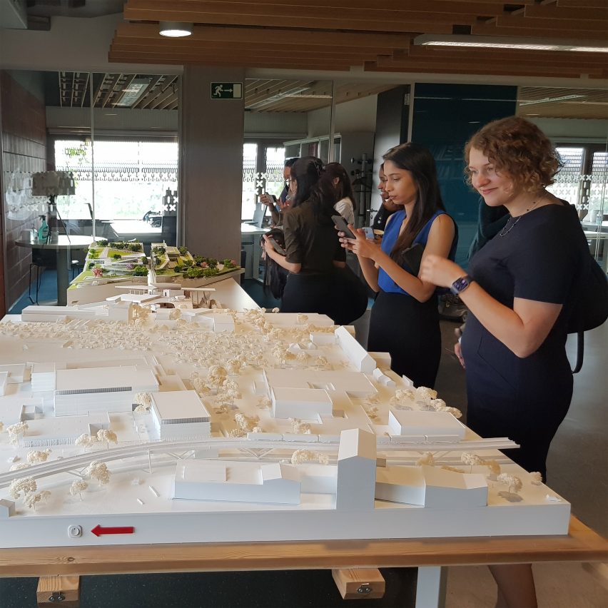 a photograph of people viewing student work