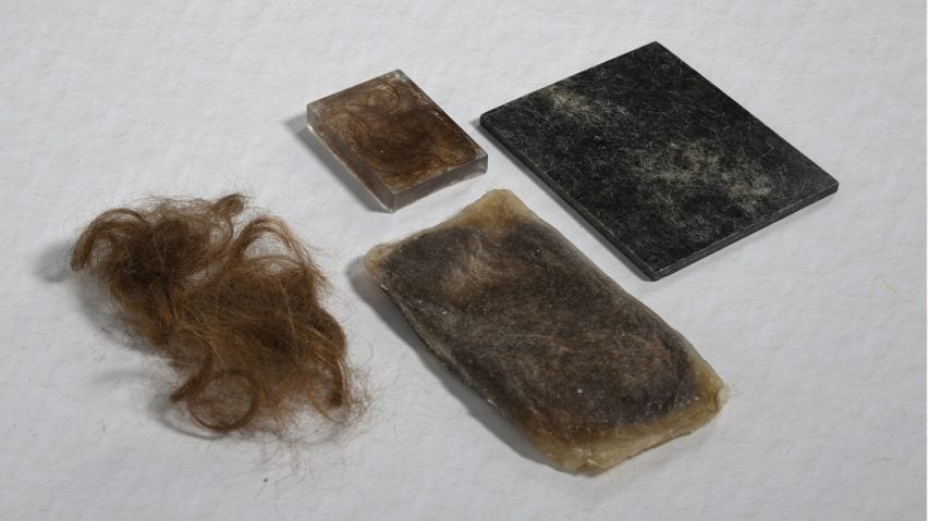 A photograph of a selection of materials in tones of brown and black against a white surface.