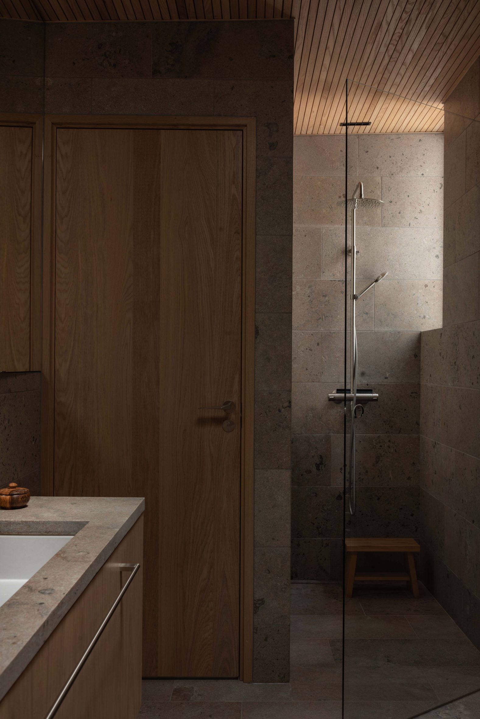 Stone bathroom within Swedish home by Johan Sundberg Arkitektur