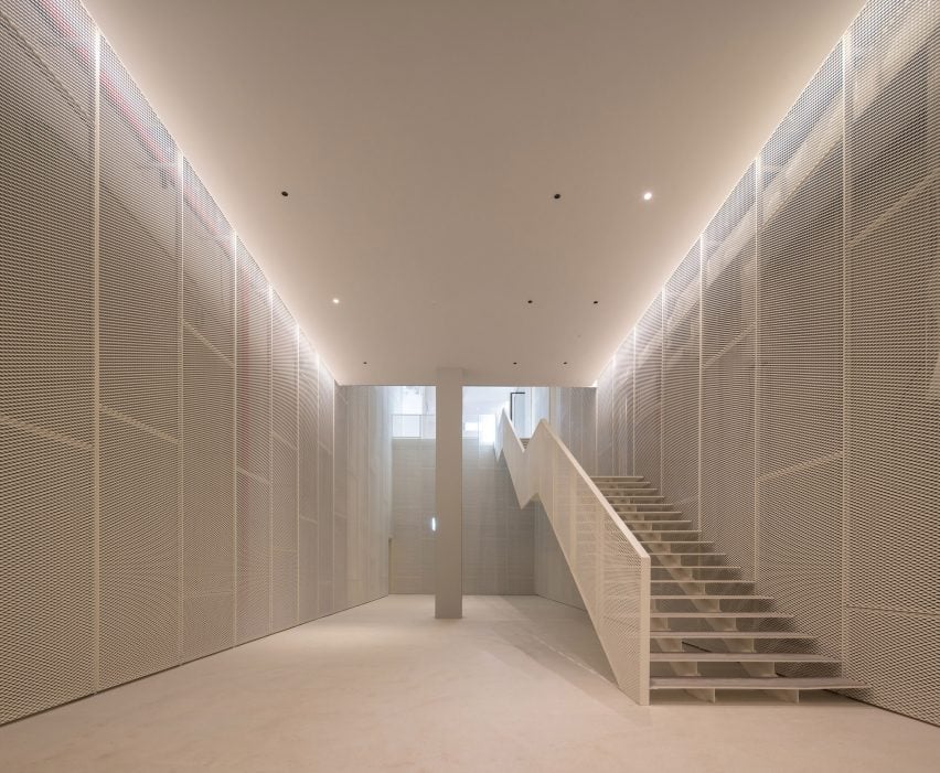 White mesh interior within refurbished arts centre by Kengo Kuma