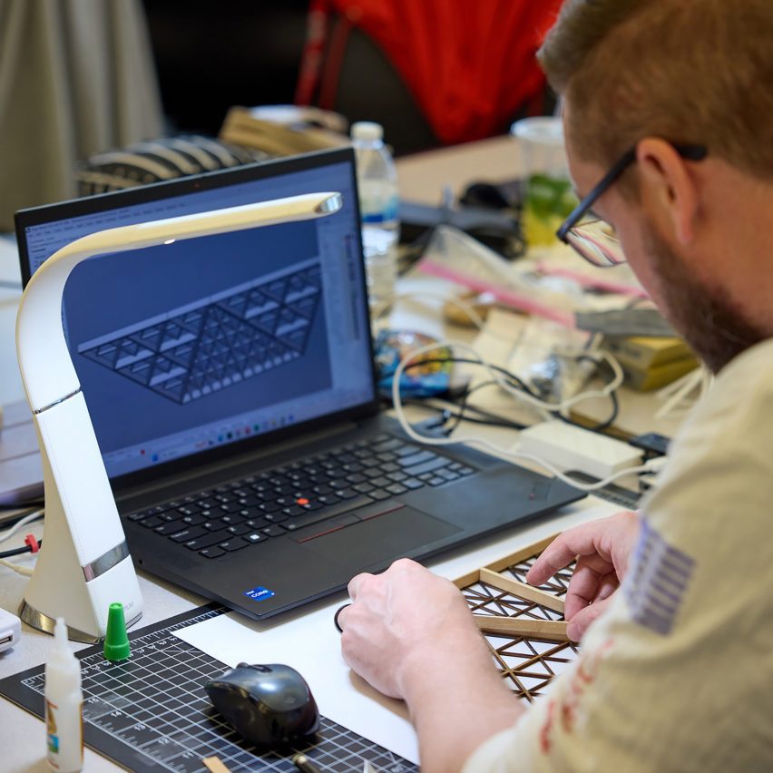 a photograph of a student using a laptop