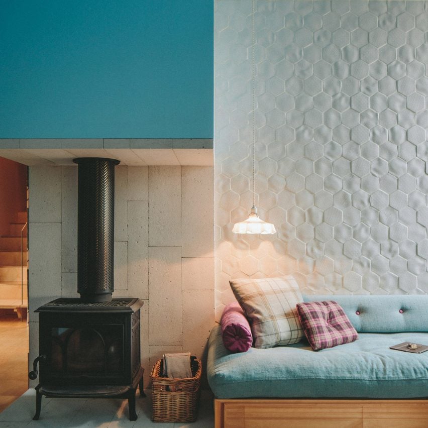 Woodburning stove and daybed in Longhouse, Australia