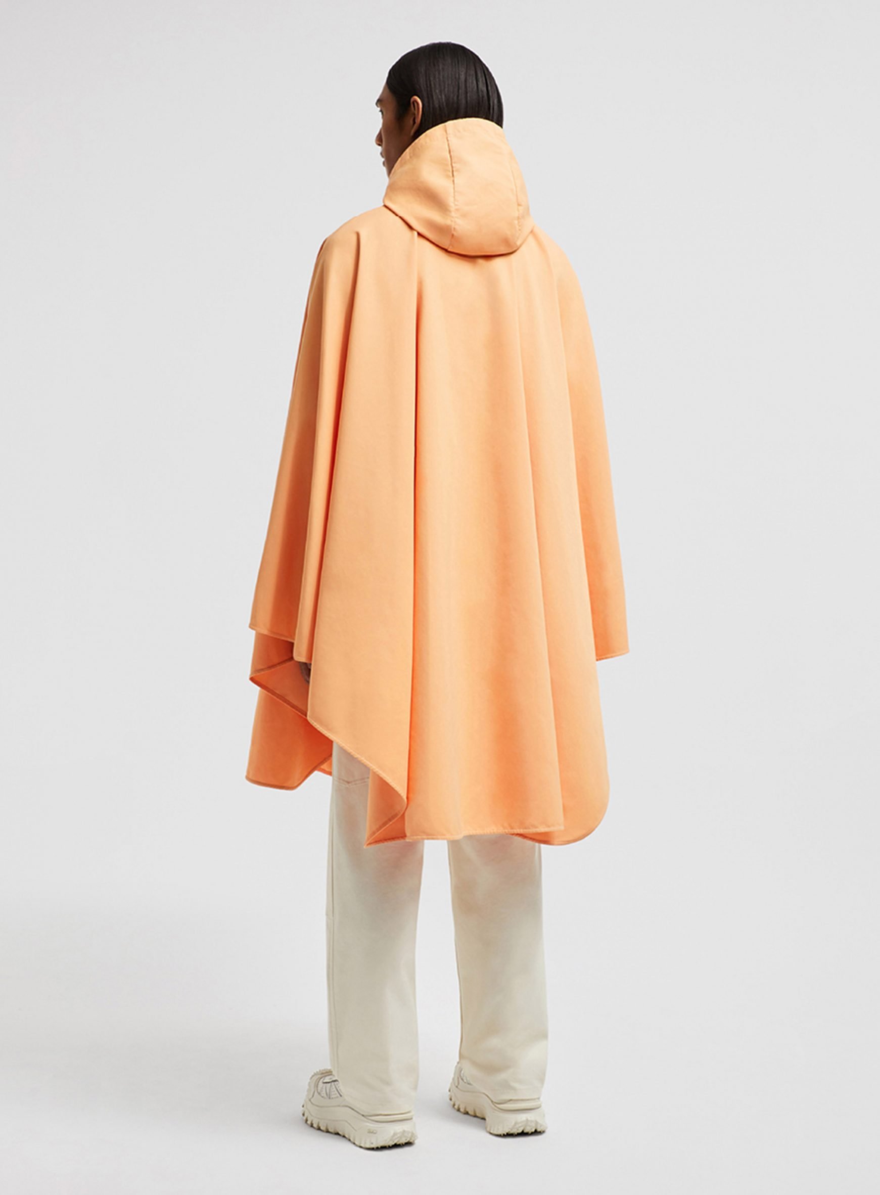 An orange poncho by Ive