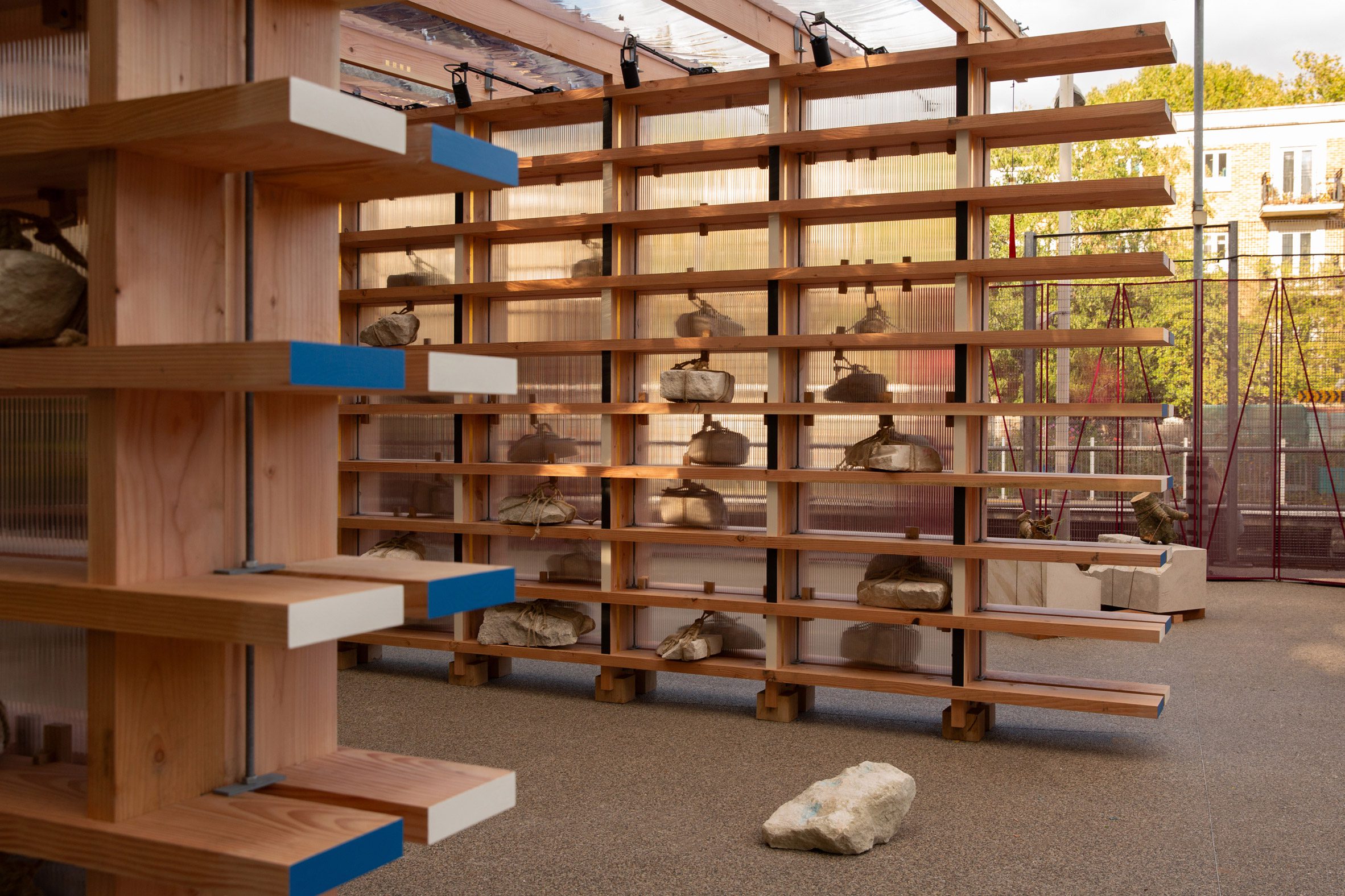 Rocks sitting on wooden shelves