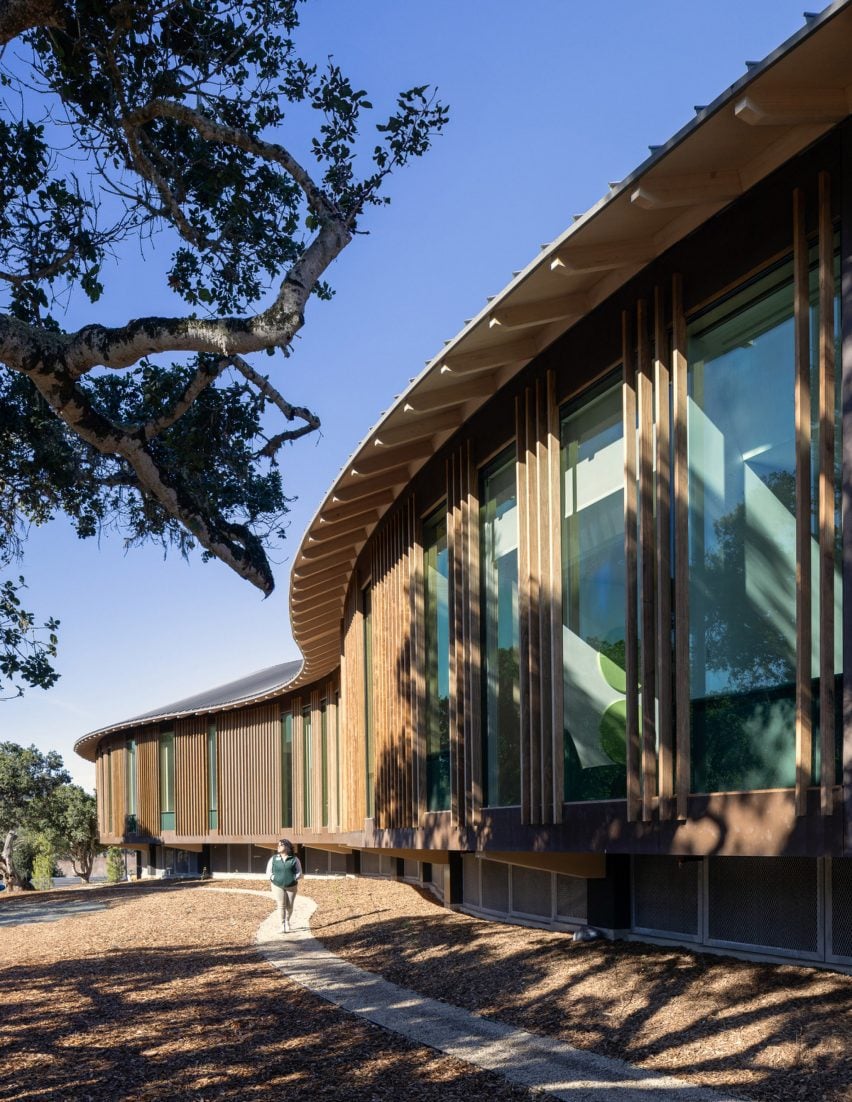 A curved building with wooden facade