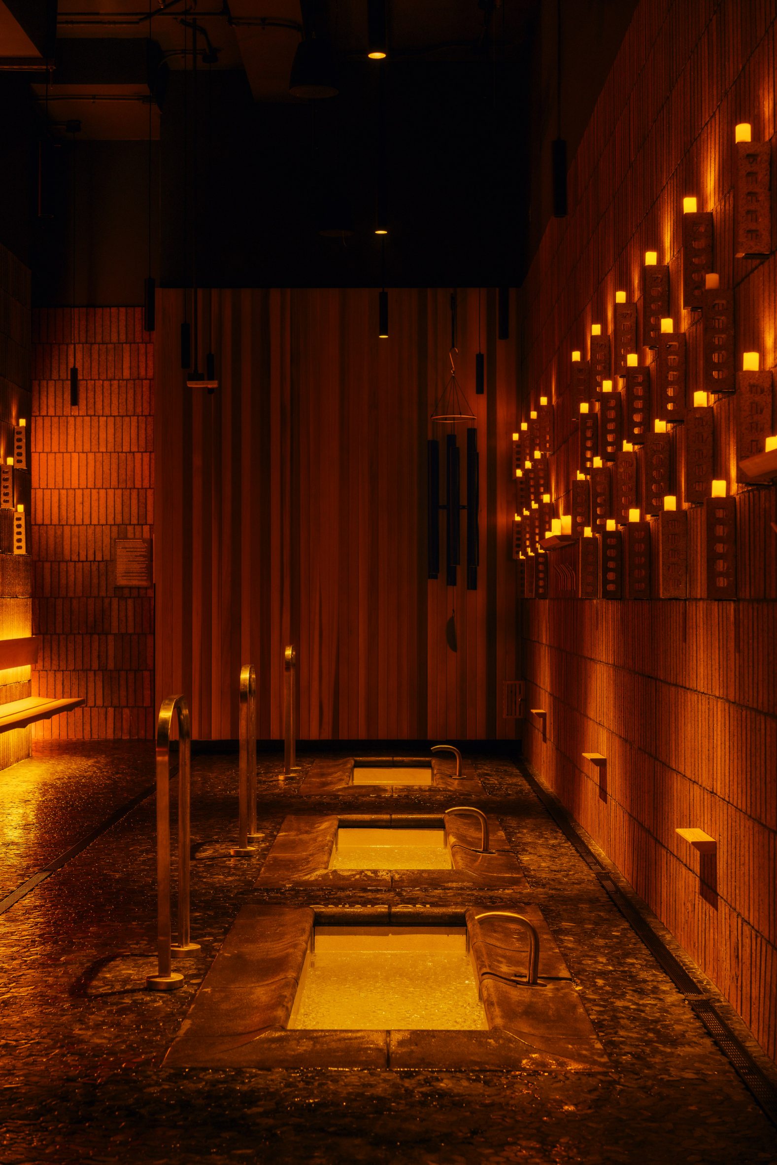 Trio of plunge pools surrounded by river stone flooring