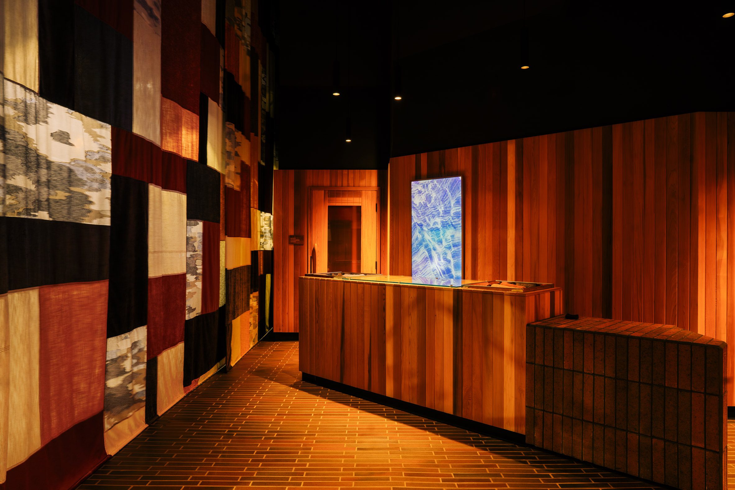 Othership reception area with a patchwork curtain blocking the street view