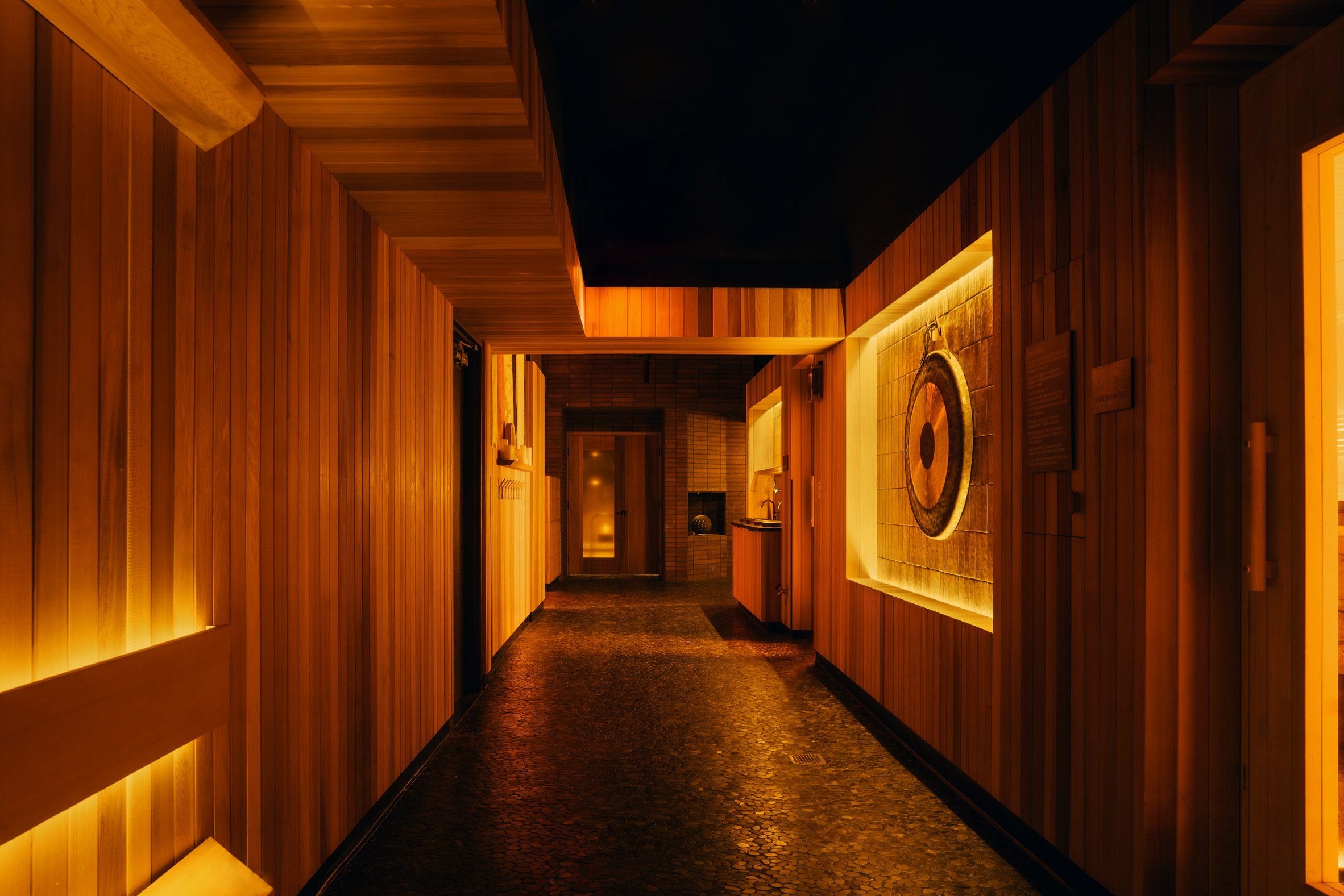 Corridor with sauna-like cedar panelling