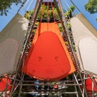 Tents protruding from columns of plants