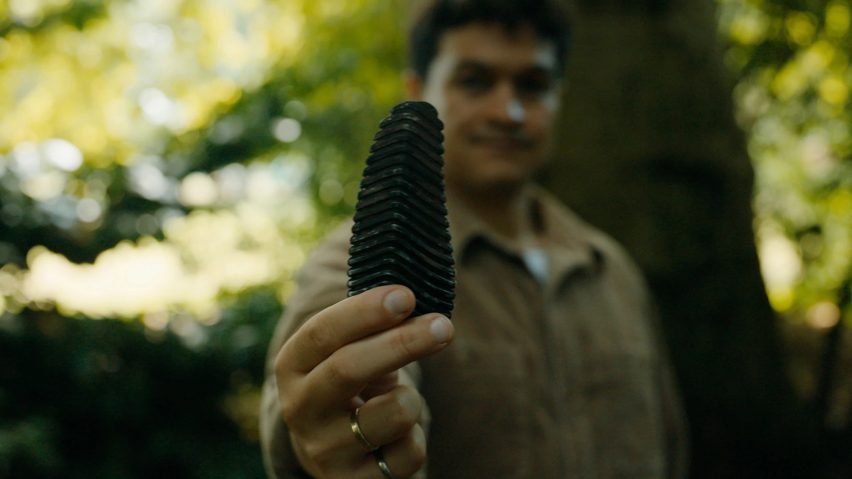 Photo of Richard Alexandre holding the Pyri device with the device in close-up