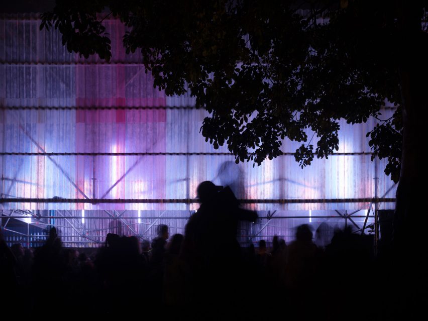 Couple in front of Agnes stage at Rally festival designed by Cake Architecture