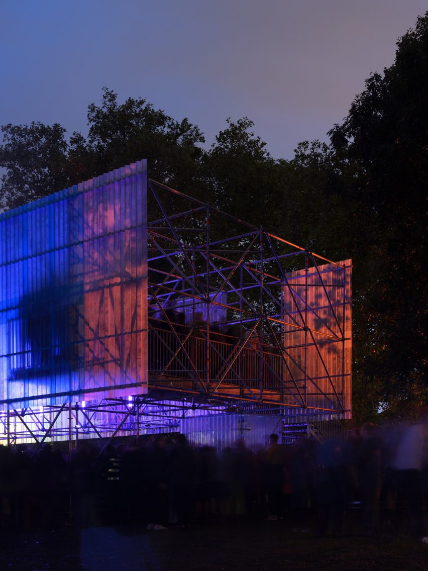 People standing on a platform overlooking a stage