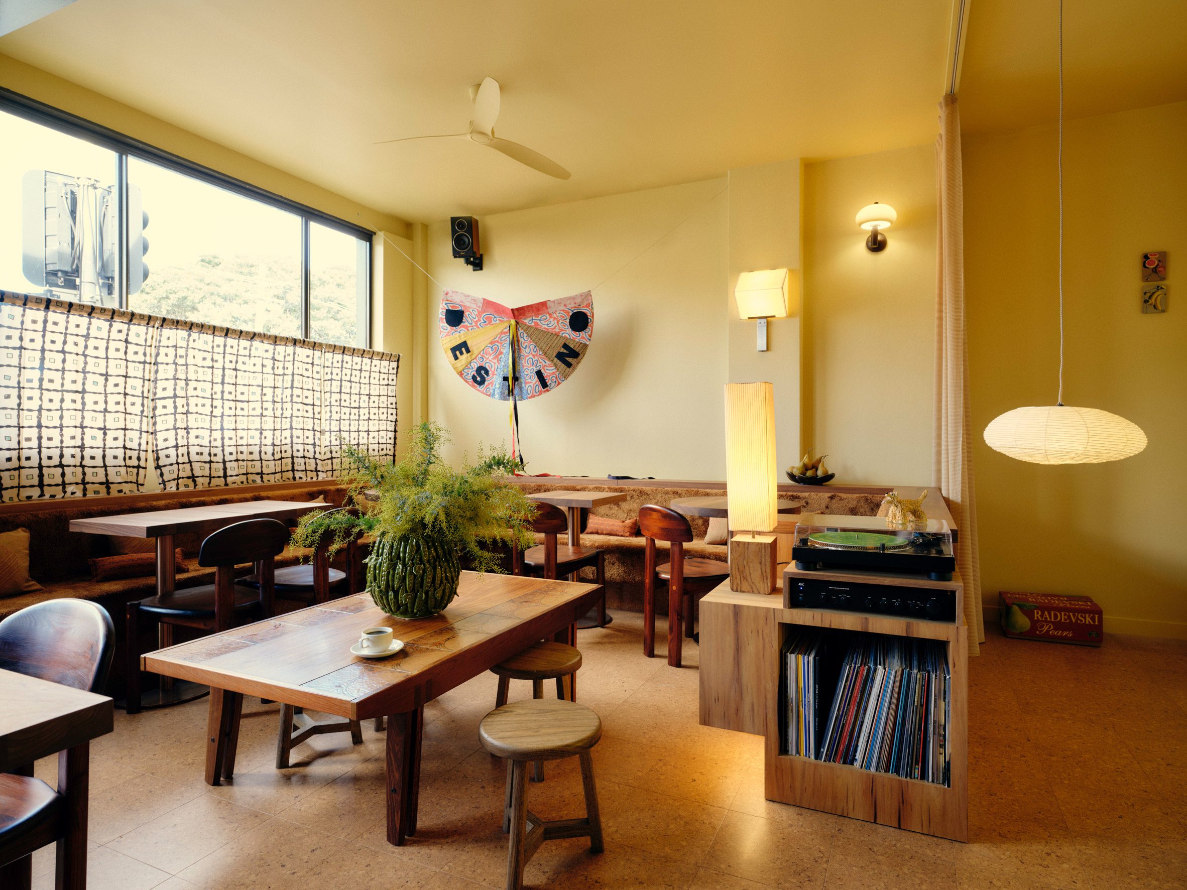 Cafe lounge area with record player and vinyls