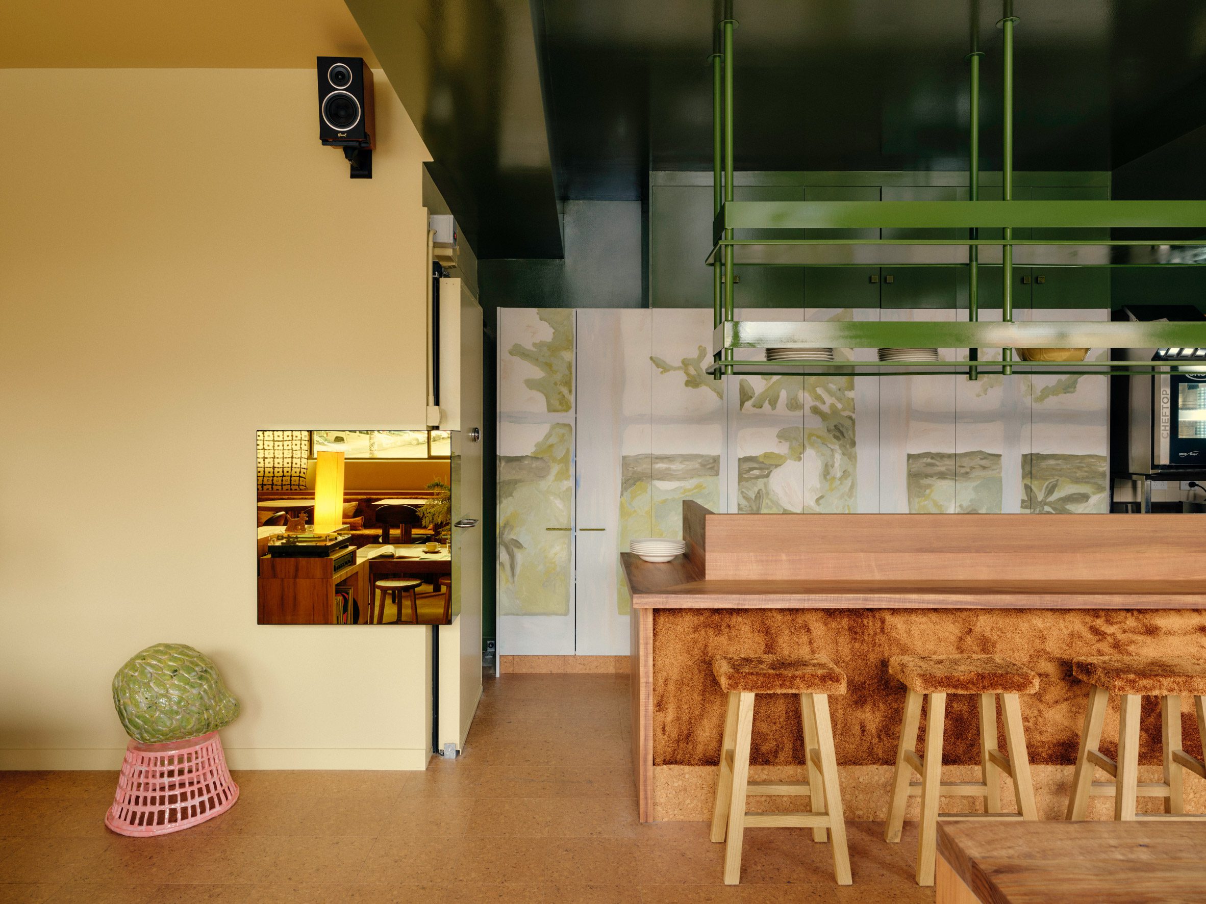 Bar seating area with carpet-clad exterior and seat tops