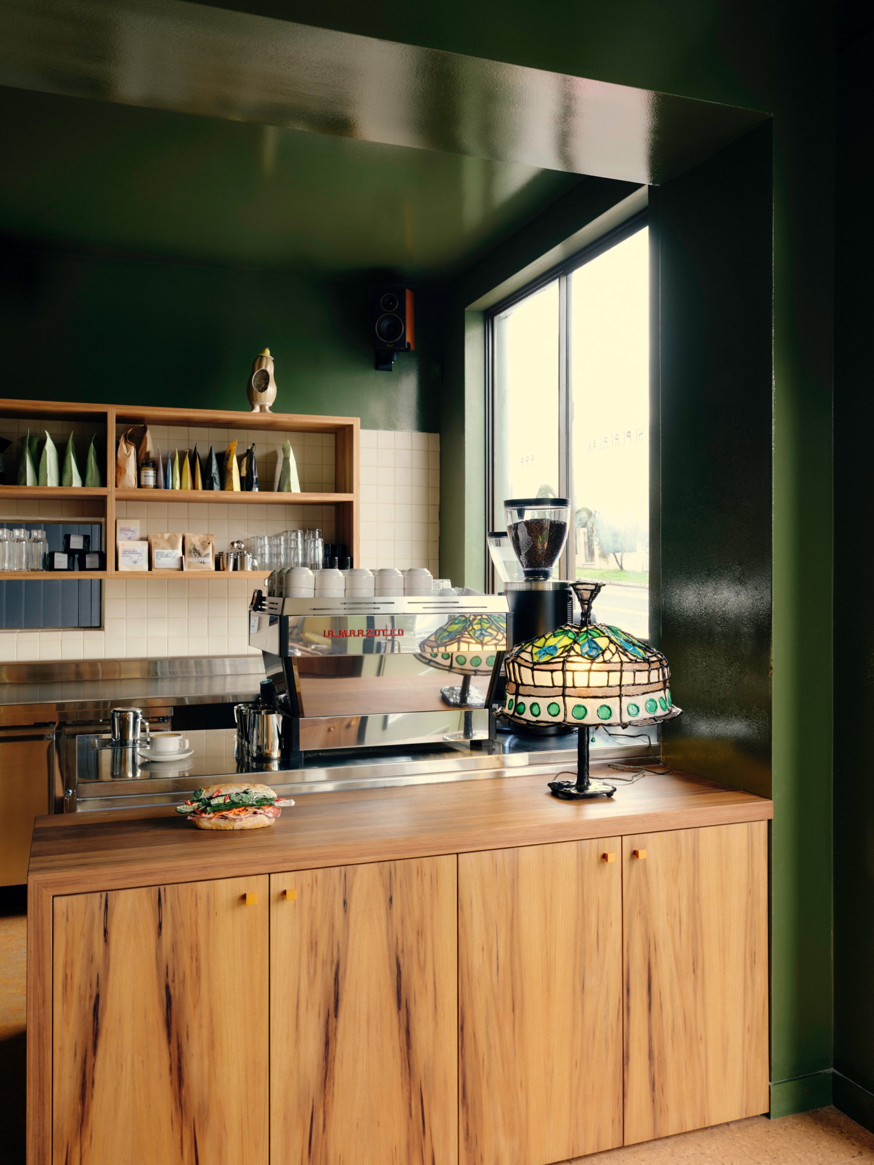 Cafe service counter with coffee machine and mosaic lamp