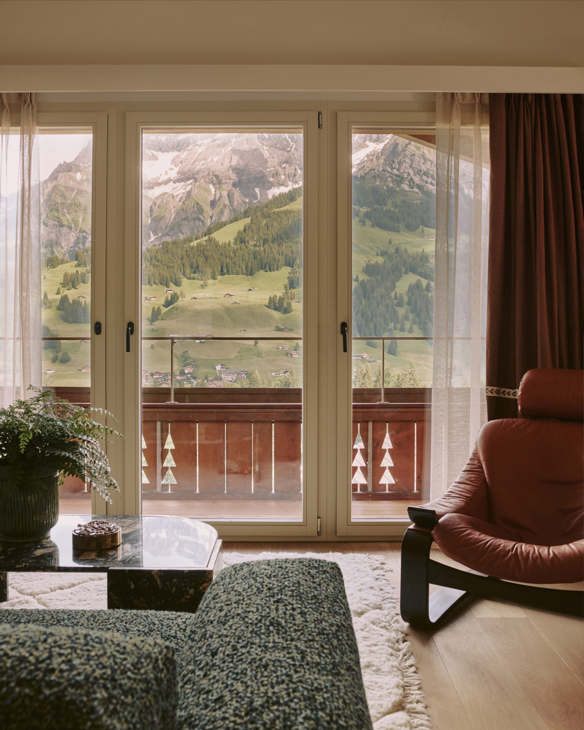 Chairs in a siting room looking out to mountain view