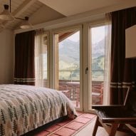 Hotel bedroom looking out to mountains