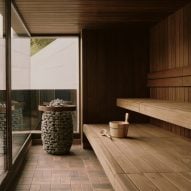 Glass fronted sauna with coal basket