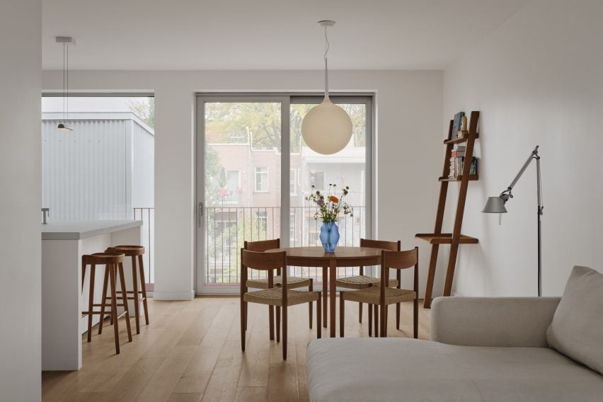 Dining area with wide-plank floors and wooden furniture