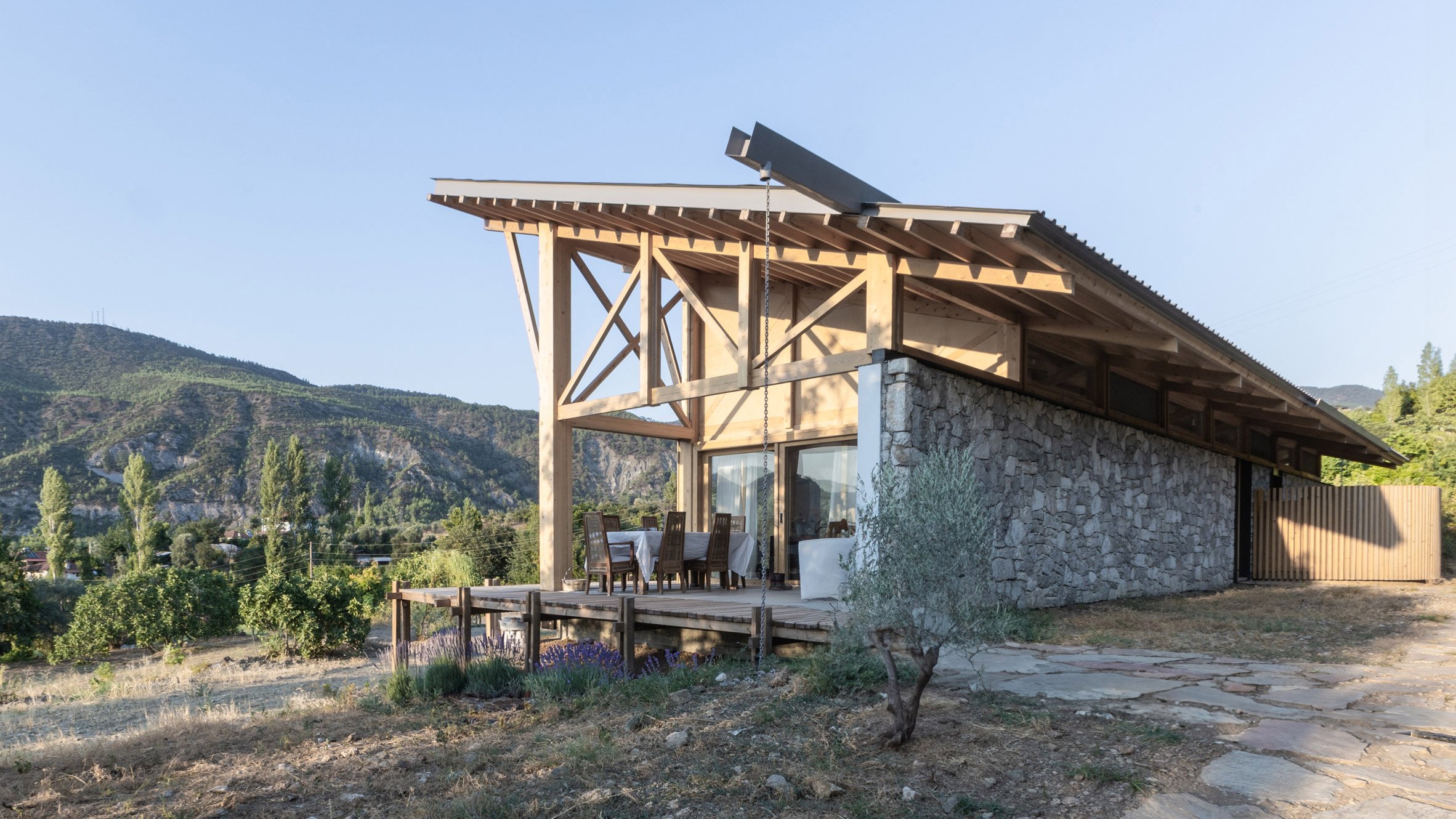 https://static.dezeen.com/uploads/2024/09/two-face-house-so-architecture-residential-turkey-stone-timber_dezeen_2364_hero.jpg