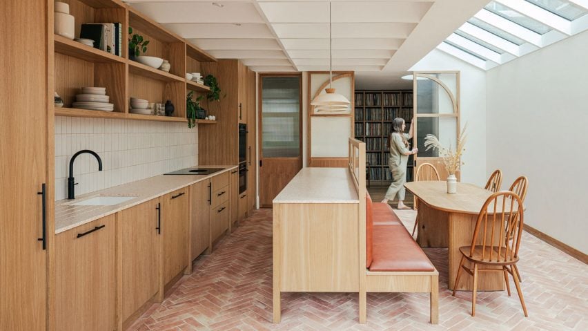 Open-plan kitchen and diner with a brick floor