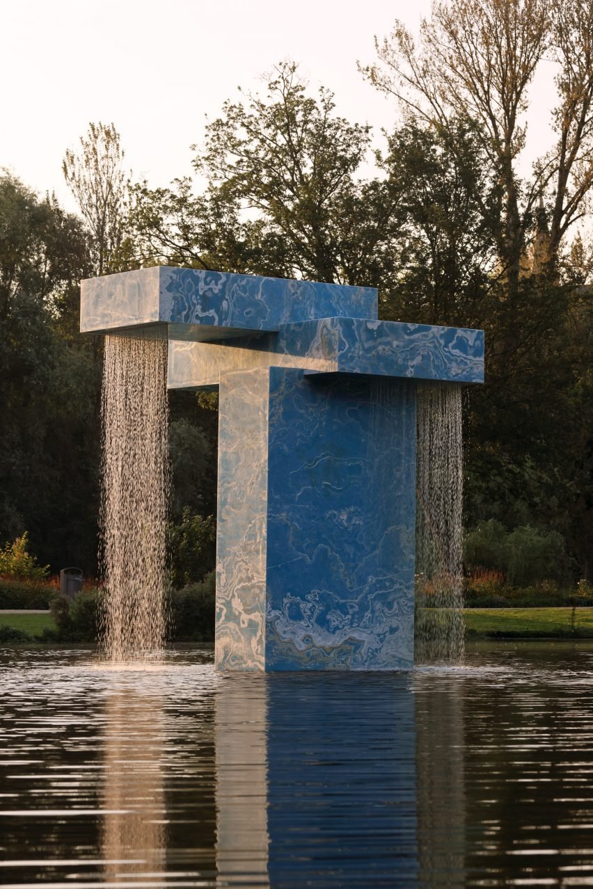 Blue water fountain on a lake