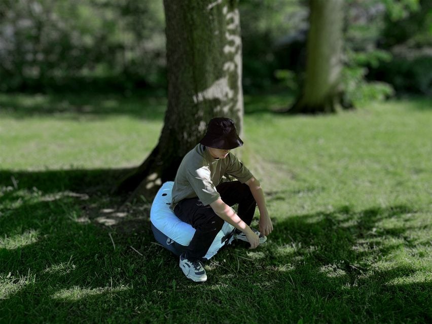 Kunrui Peng demonstrating his inflatable hiking toilet