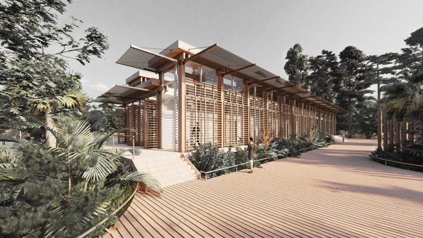 A visualisation of a building with slatted wooden walls, in tones of brown and white. In front of it is a brown wooden deck and green bushes and trees.