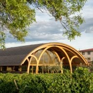 Foster + Partners expands Spanish winery with "discreet" barrel-vaulted structure