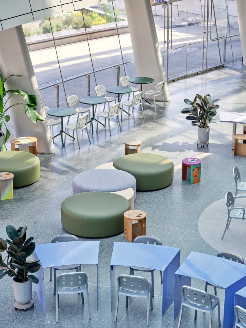 Large round poufs within a cafe setting