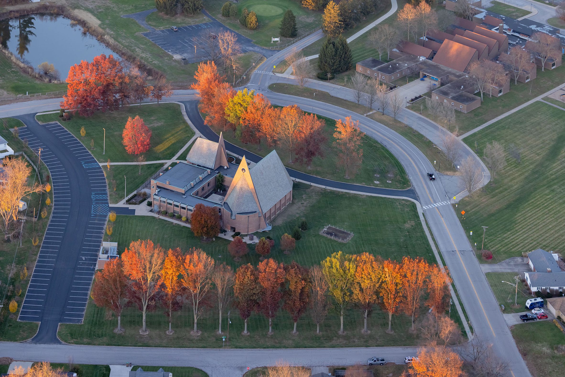 Modernist church with multi-coloured leaves 