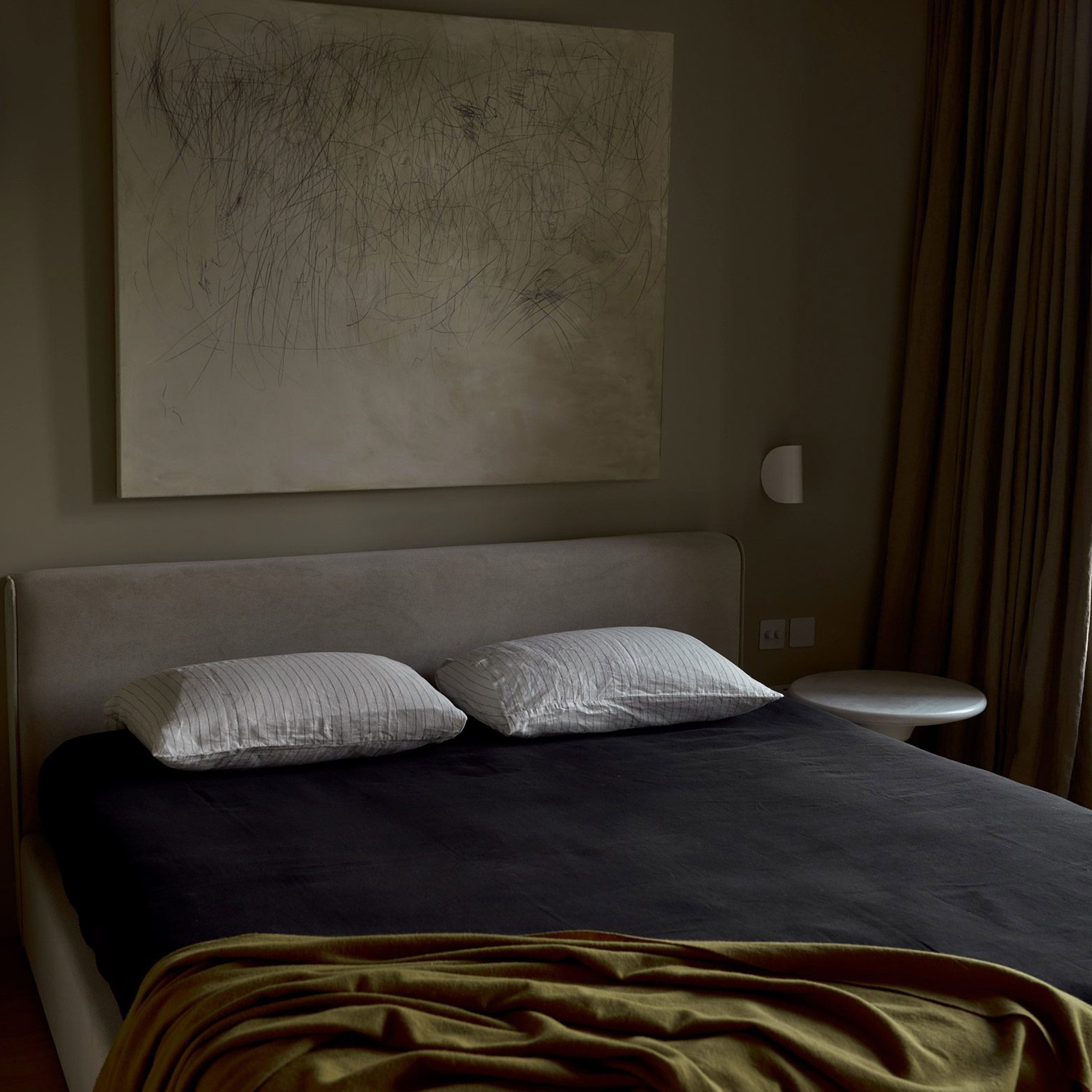 Dark bedroom with green walls