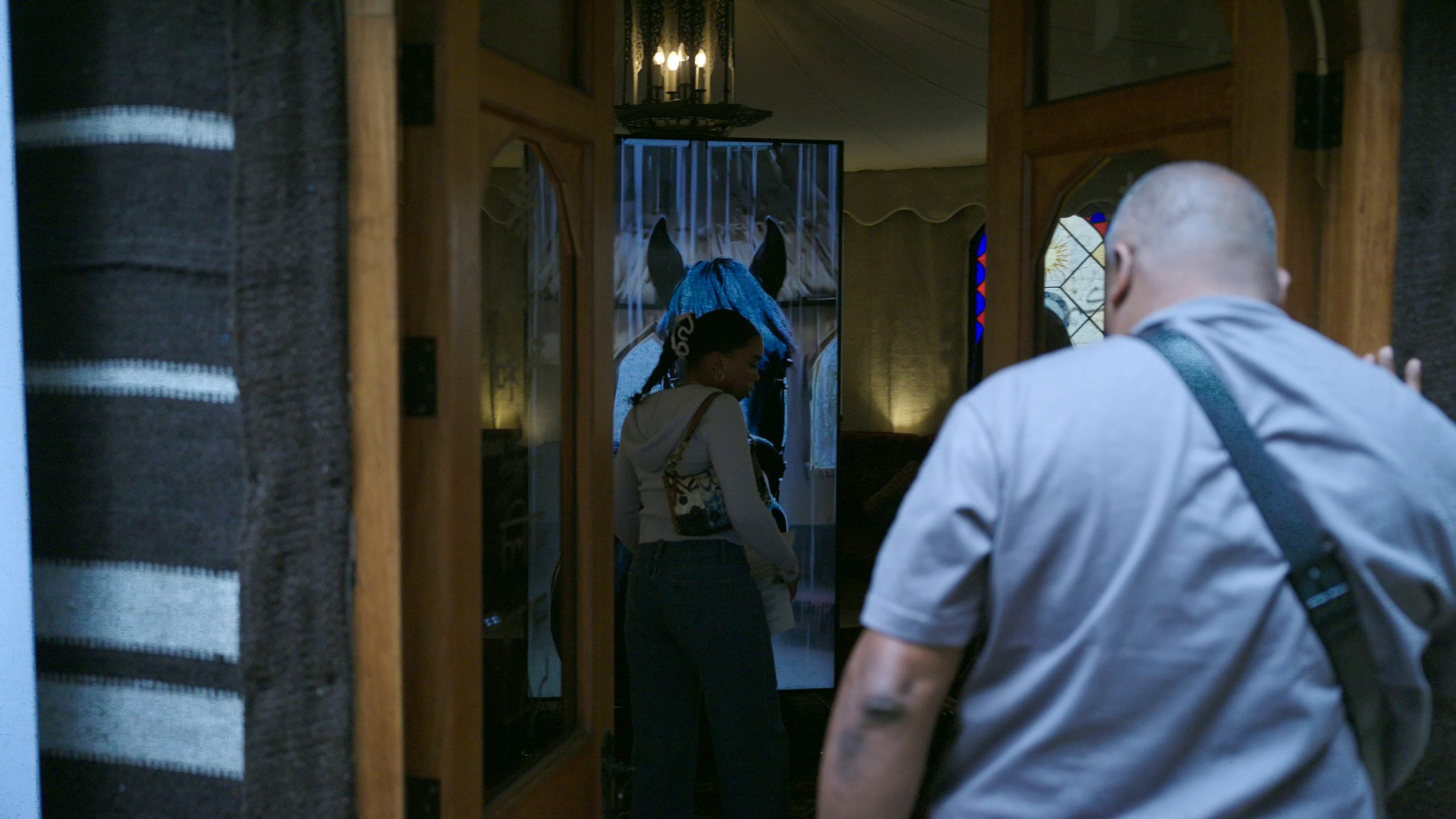 Tent doorway with horse on screen inside