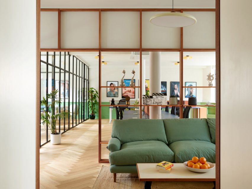 Lobby with green sofa in Drama Republic Office by Emil Eve Architects