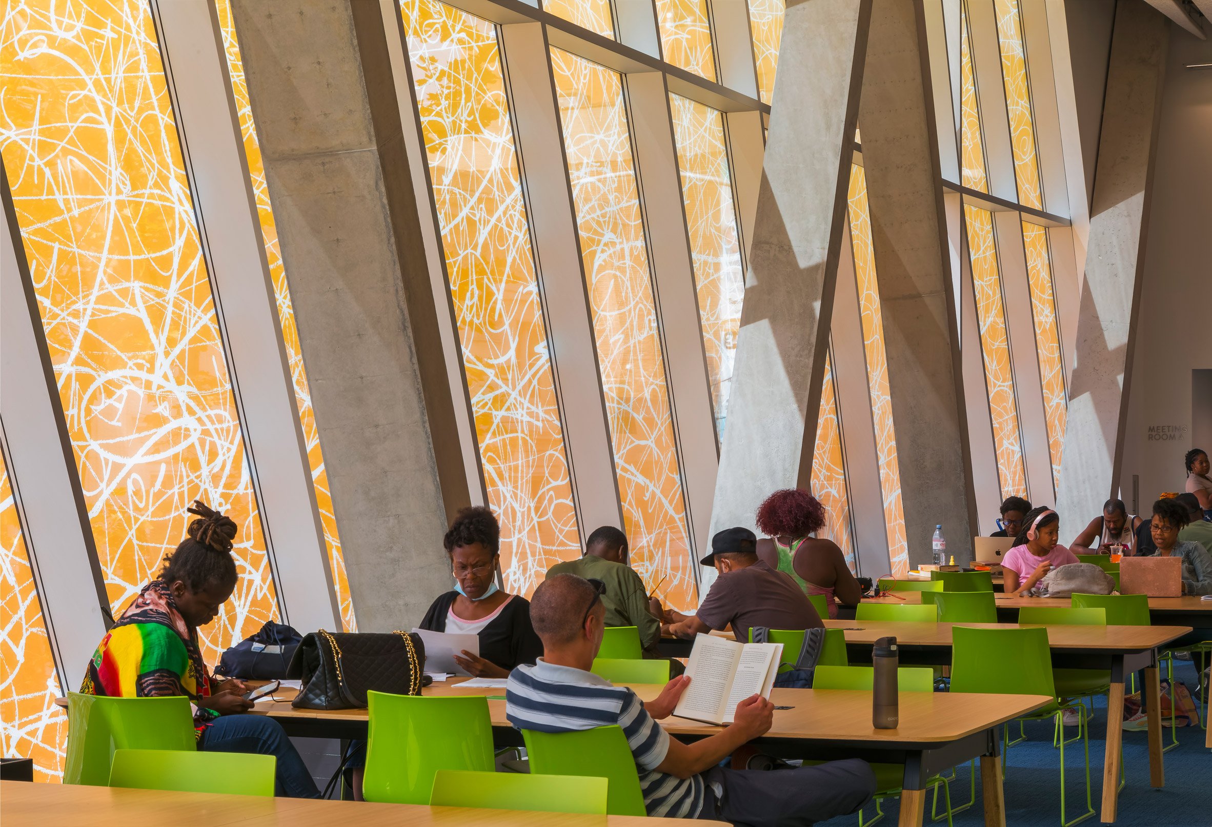 People sitting in green chairs