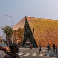 Snøhetta wraps Queens library in orange ombre glass covered with script