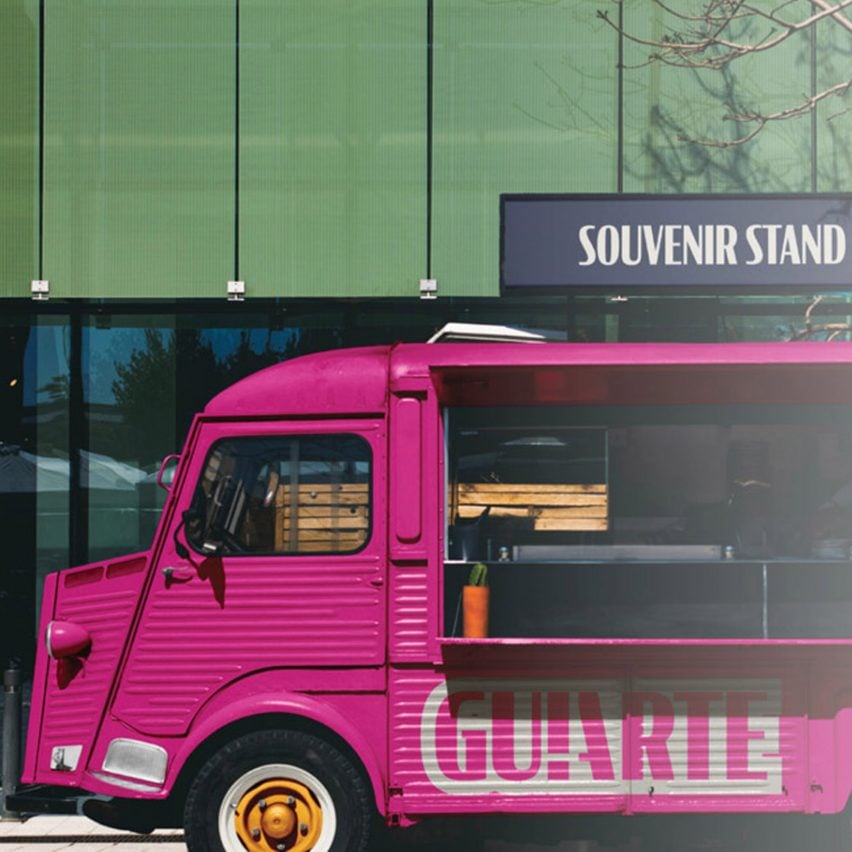 A photograph of a van in tones of pink and black, against a green backdrop.