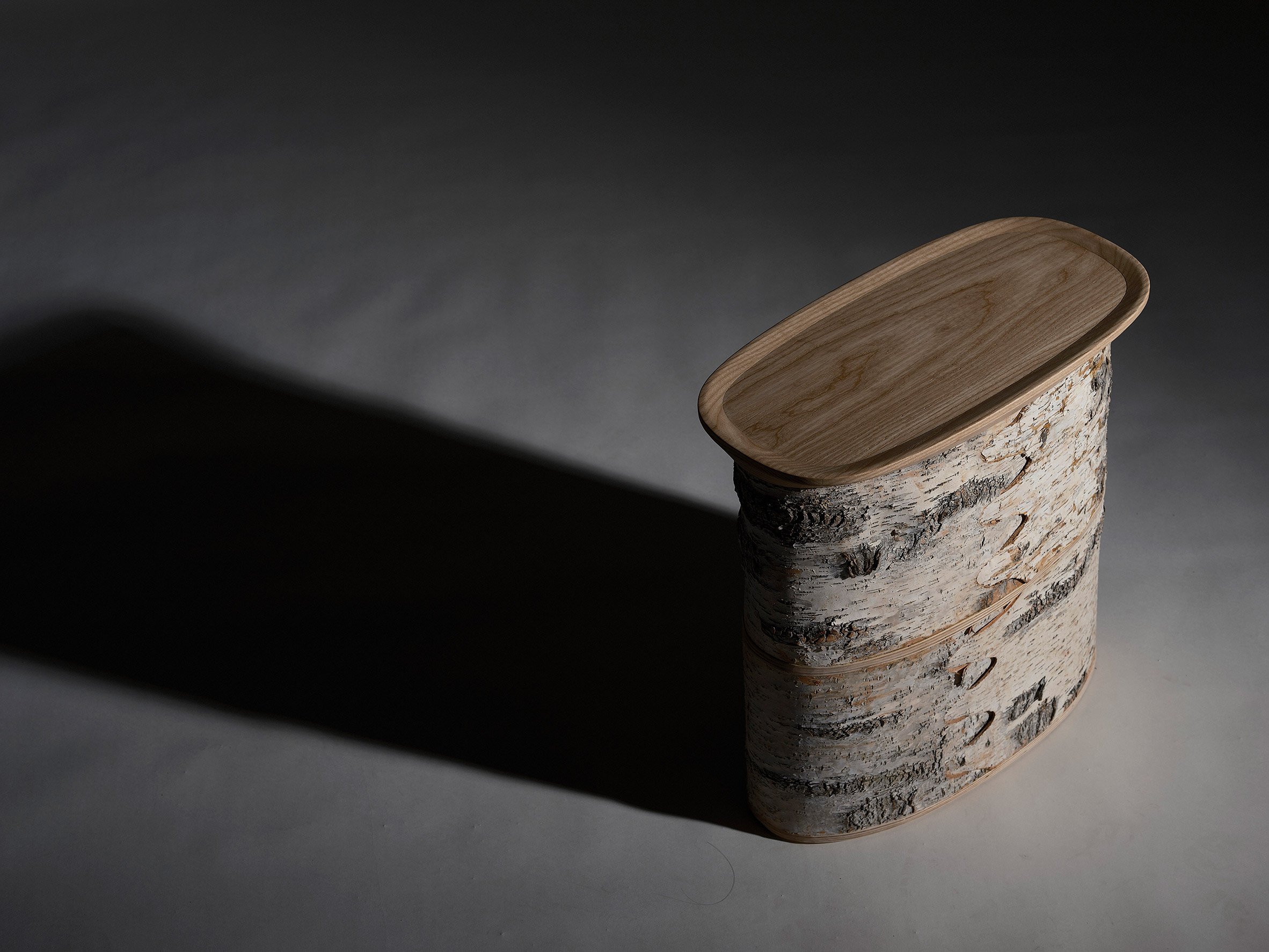 Wooden seat on dark backdrop