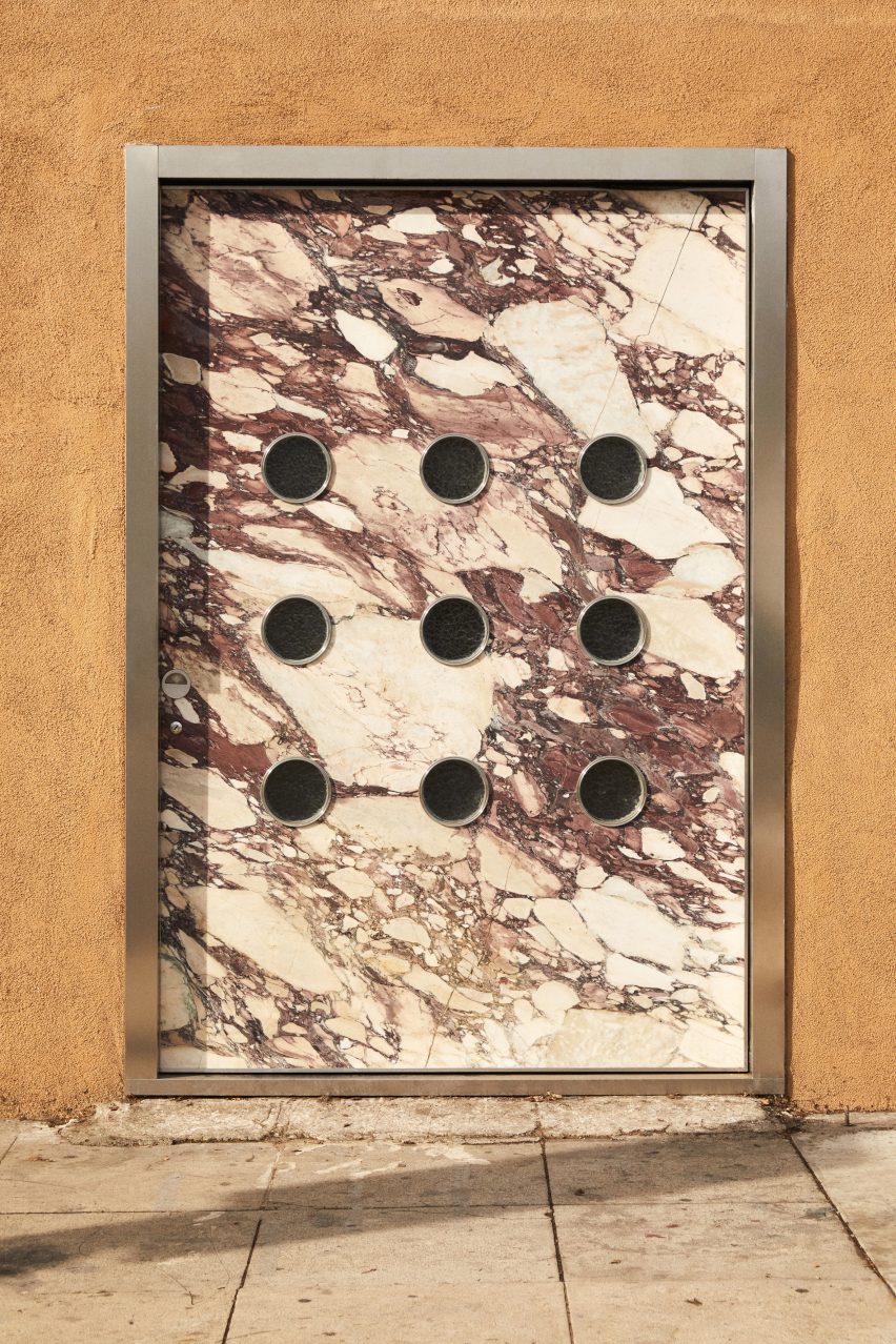 Marble pivot door at FORM(LA)