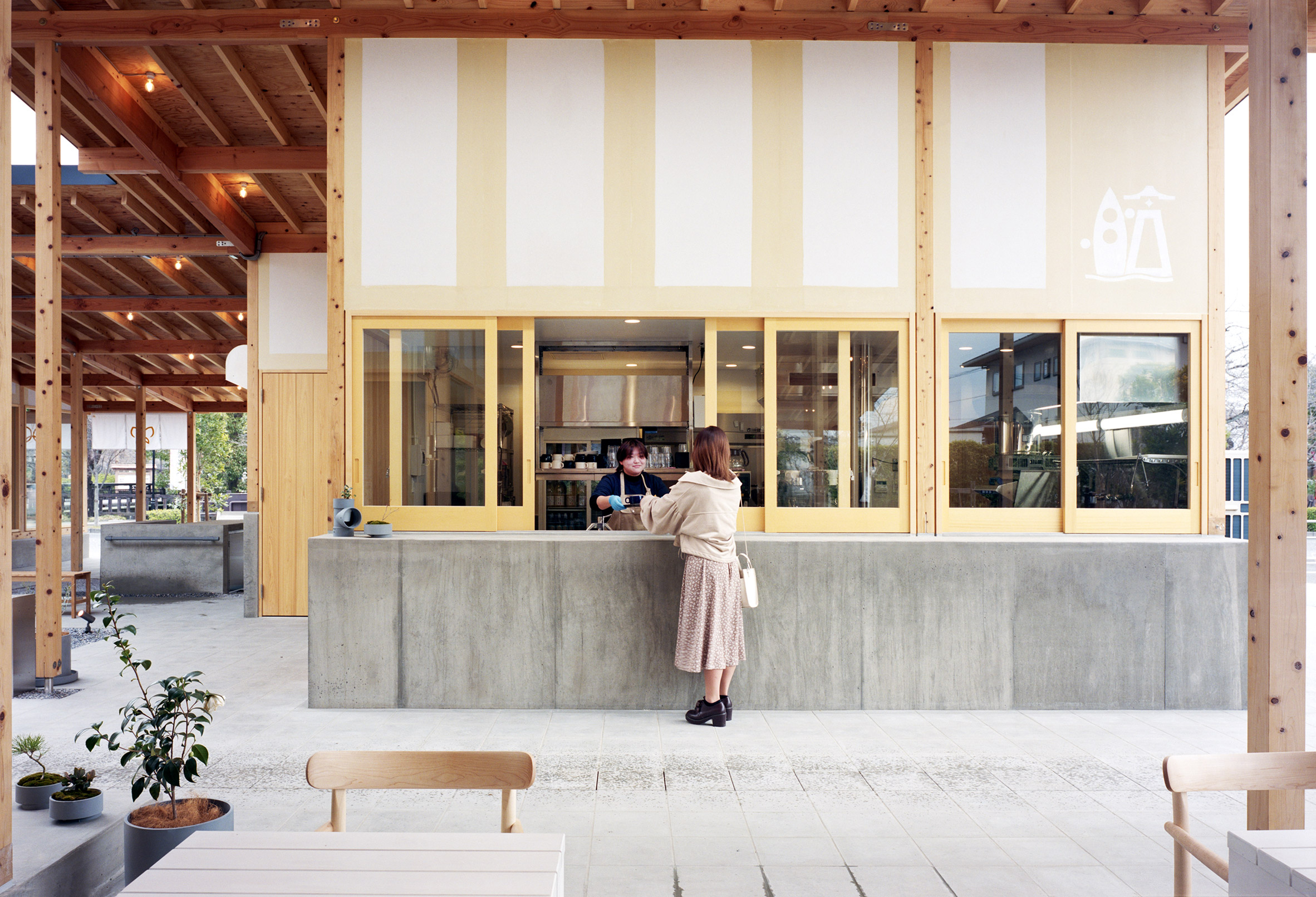 Woman at counter of Japanese cafe