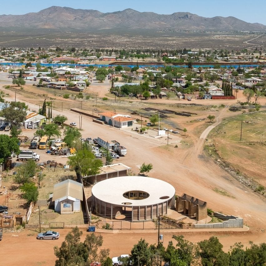 Circular community building in Sonora with city in background