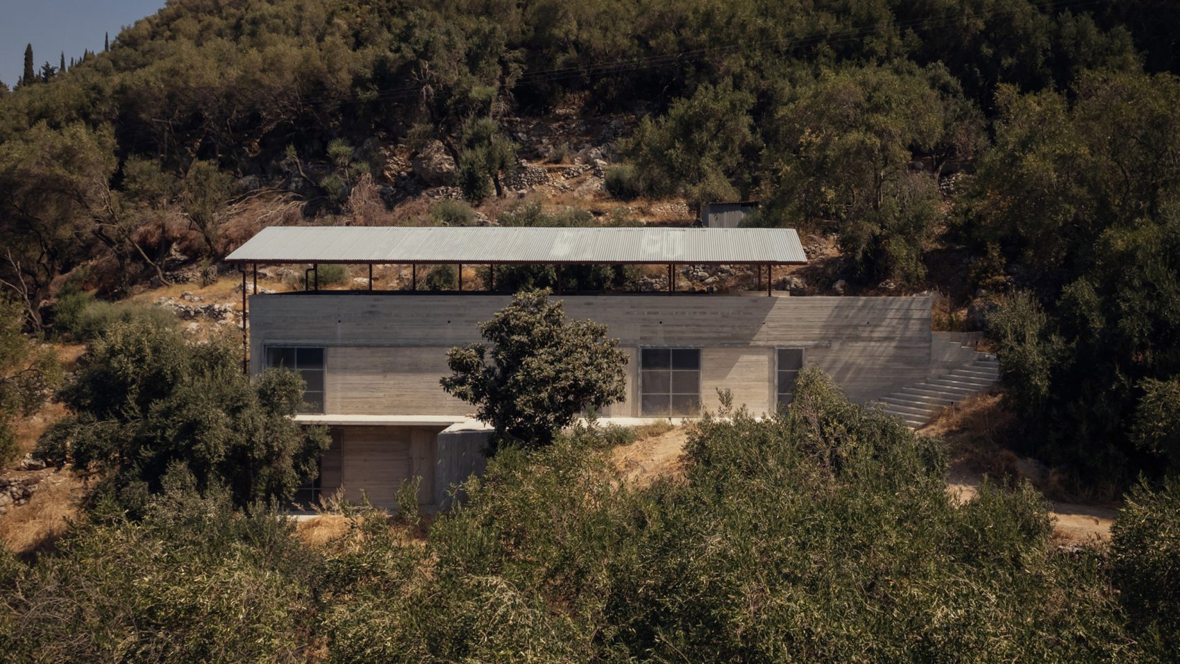 Concrete house in rural Greek olive grove