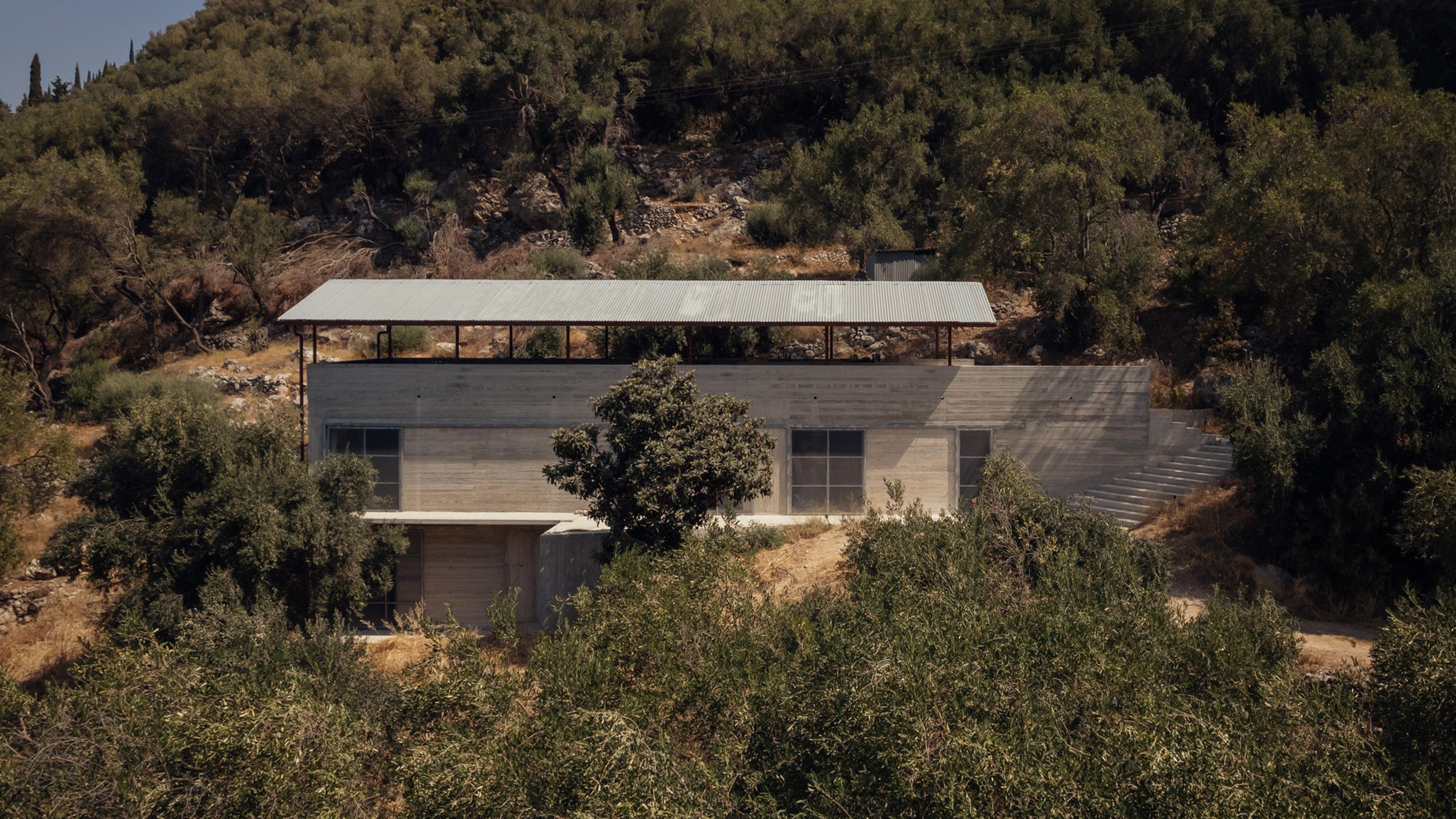 https://static.dezeen.com/uploads/2024/10/invisible-studio-house-in-an-olive-grove-greece-hero_dezeen_2364_col_0.jpg