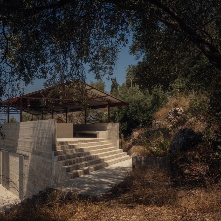 Steps up to communal space within Greek home by Piers Taylor