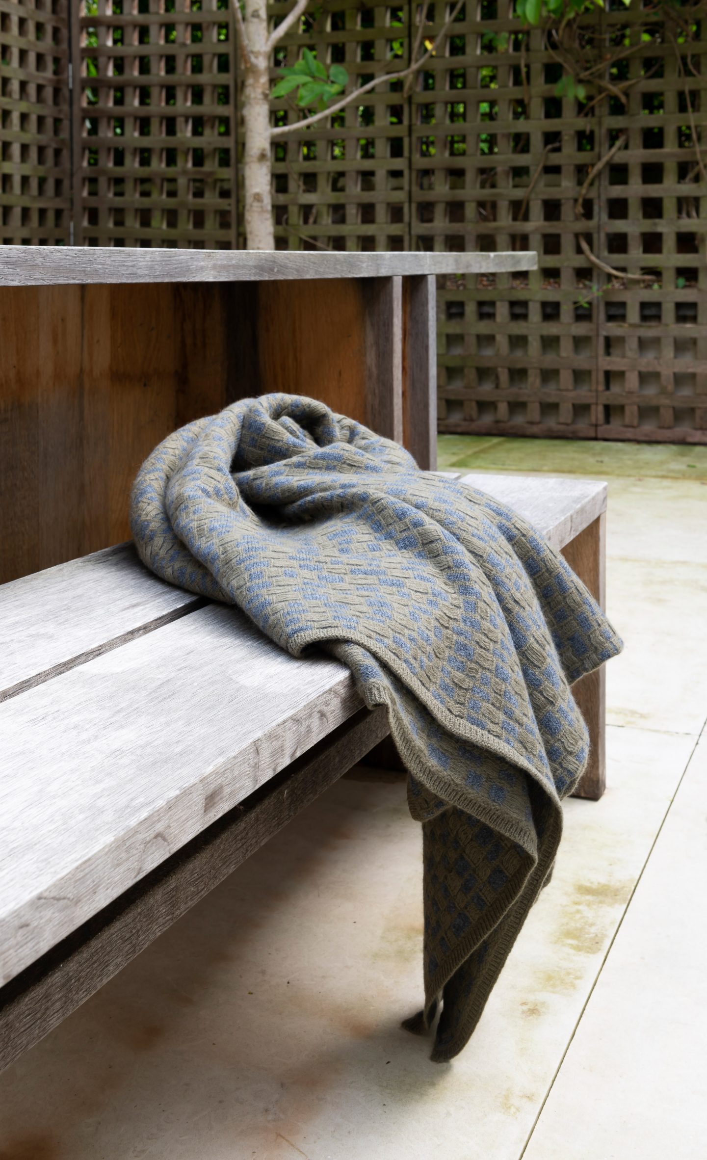 Blanket on wooden bench