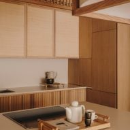 Rattan and wood lined kitchen Miriam Barrio Studio